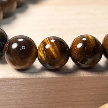 Load image into Gallery viewer, Tiger's Eye Bracelet with Trinity Knot 10mm (Unisex)