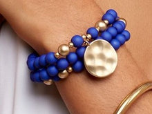 Load image into Gallery viewer, Wrap stretch, COBALT, bracelet composed of matte beads and a hammered, matte gold coin charm.
